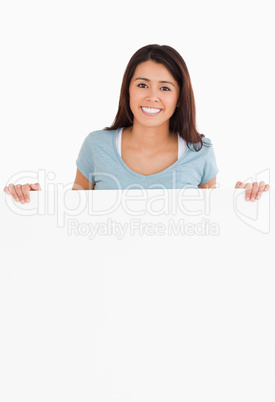 Attractive woman holding a  board