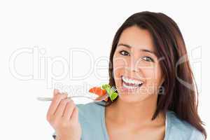 Good looking woman eating salad