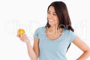 Attractive woman holding an orange
