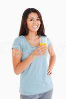 Beautiful woman holding a glass of orange juice
