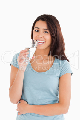 Gorgeous woman drinking a glass of water