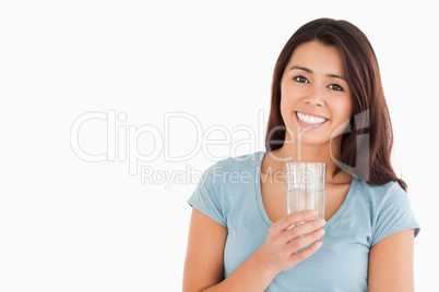 Lovely woman holding a glass of water