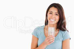 Lovely woman holding a glass of water
