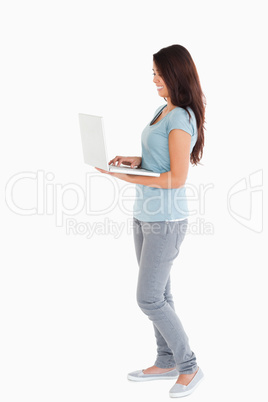 Gorgeous woman relaxing with her laptop