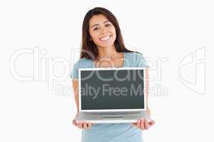 Beautiful woman posing with her laptop