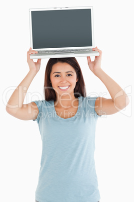 Gorgeous woman posing with her laptop