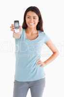 Attractive woman showing her mobile phone