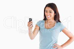 Good looking woman looking at her mobile phone