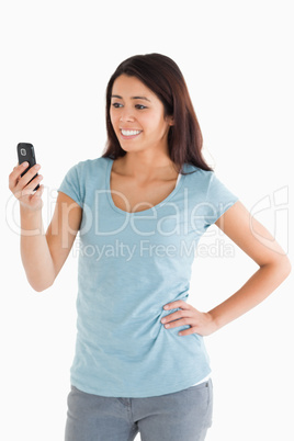 Beautiful woman looking at her mobile phone