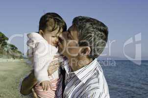 Baby with her Father on the Beach