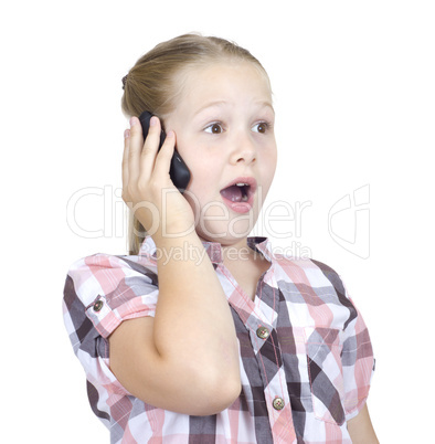 The beautiful girl with astonishment speaks on the phone