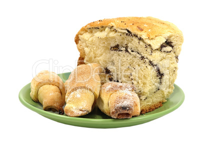 Piece of poppy cake and cookies.