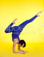 woman exercise yoga pose asana - blue on yellow
