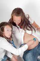 Beautiful pregnant woman with daughter