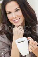 Beautiful Young Woman Drinking Tea or Coffee