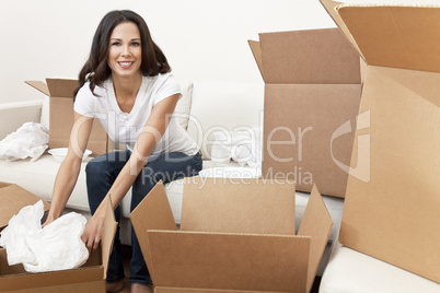 Single Woman Unpacking Boxes Moving House