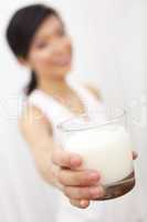 Asian Chinese Girl Holding Glass of Milk to Camera