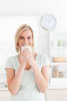 Woman holding cup of coffee