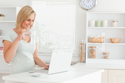 Woman with a cup of coffee and a laptop