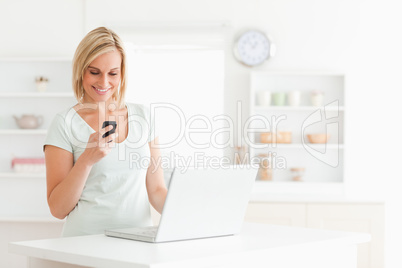 Cute woman with a mobile and a laptop