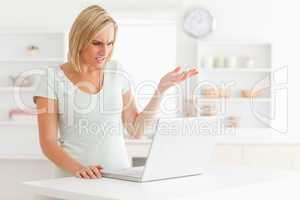 Upset woman looking at notebook without having any clue what to