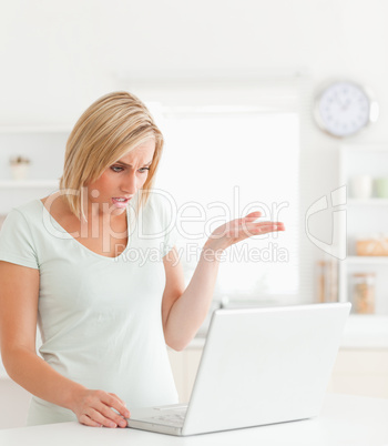 Angry woman looking at notebook without having any clue what to