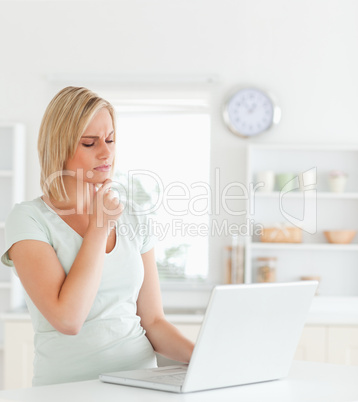 Wondering gorgeous woman looking at notebook