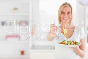 Woman offering salad