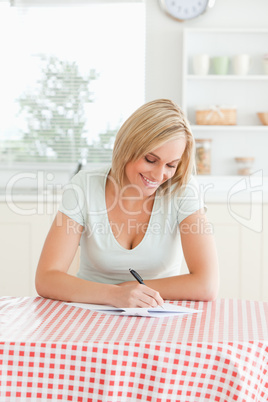 Smiling woman proof-reading a text
