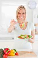 Beautiful woman offering salad