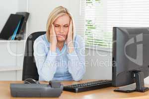 Frustrated looking woman with eyes closed