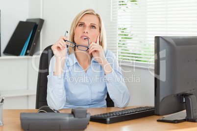 Thoughtful woman with glasses