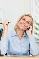 Portrait of a businesswoman smiling at the ceiling