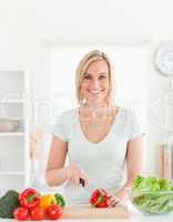 Young woman cutting vegetables