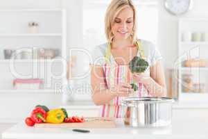 Woman cooking broccoli