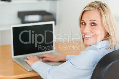 Gorgeous businesswoman looking into camera