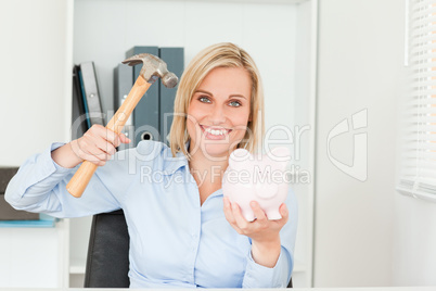 Expectantly woman wanting to destroy her piggy bank