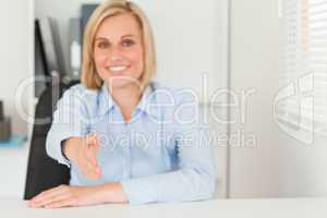 Businesswoman giving hand