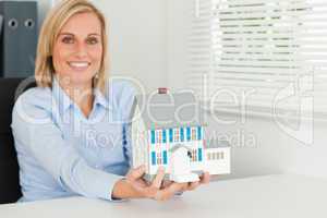 Woman showing model house