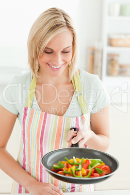 Woman looking at filled pan