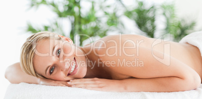 Good looking woman relaxing on a lounger
