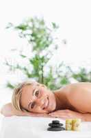 Smiling blonde woman lying on a lounger