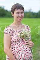 Pregnant woman with chamomile