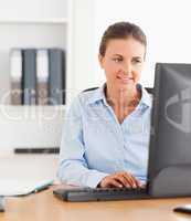 Close up of an office worker typing on a keyboard