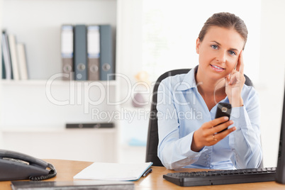 Young businesswoman using her mobile phone