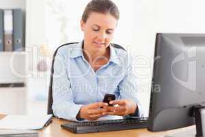 Working woman using her mobile phone