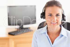 Office worker with a headset posing