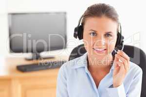 Office worker with a headset posing