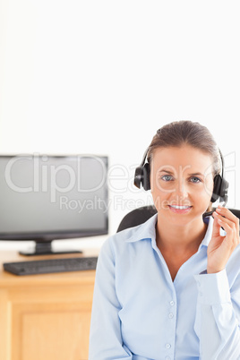 Smiling secretary wearing a headset