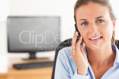 Smiling businesswoman speaking on the phone